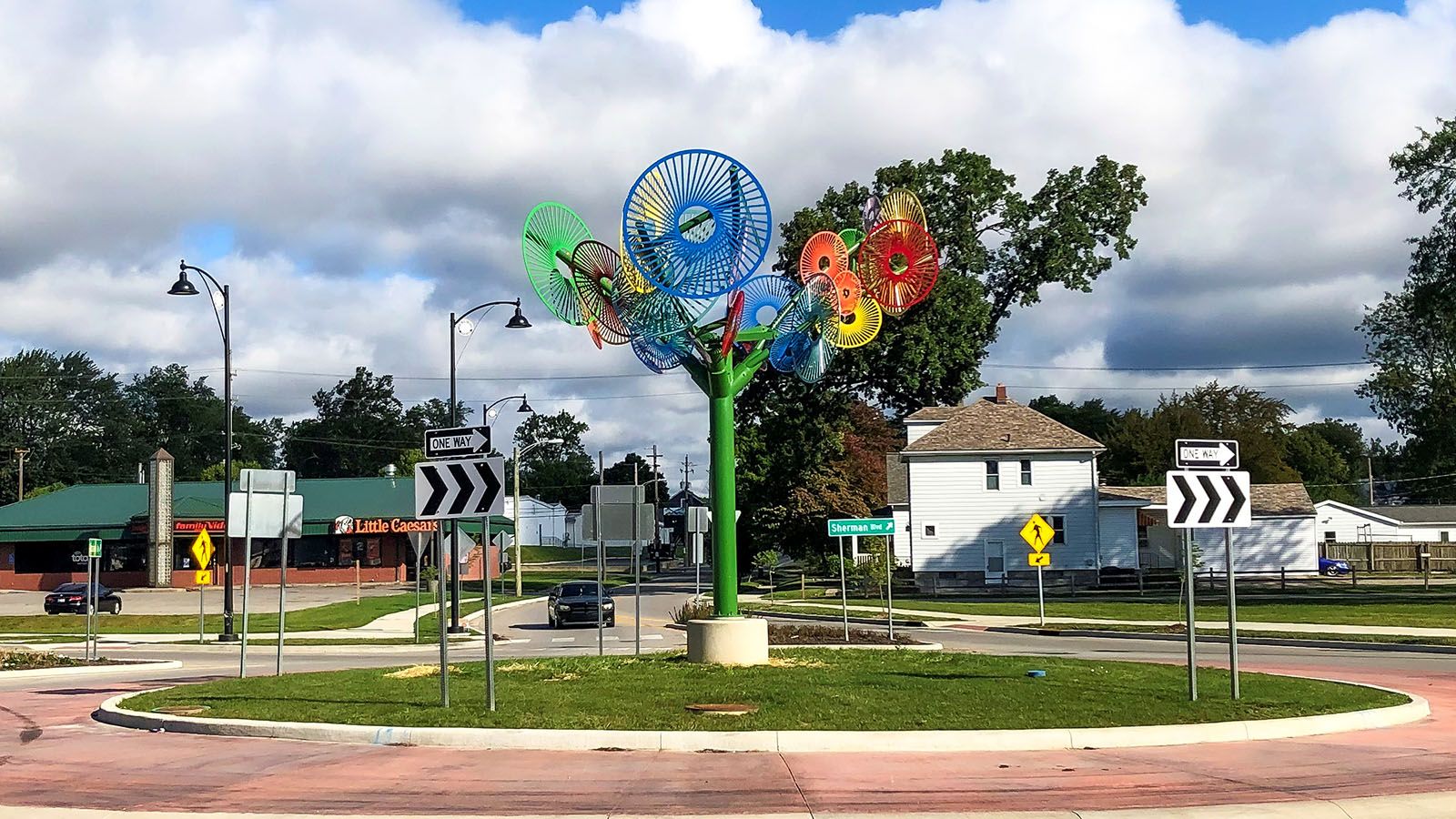 A sculpture by Suscan Zoccola stands at the Goshen Avenue and Sherman Boulevard roundabout.
