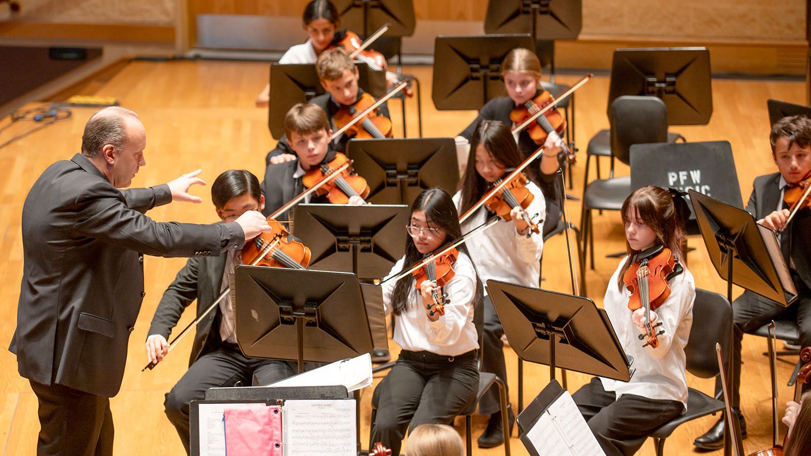 Troy Webdell, Fort Wayne Philharmonic youth education and family concert conductor, leads the Youth Orchestras in a performance. The young musicians will begin their 2024-25 season on Sunday, Oct. 27, at Auer Performance Hall on the campus of Purdue University Fort Wayne.