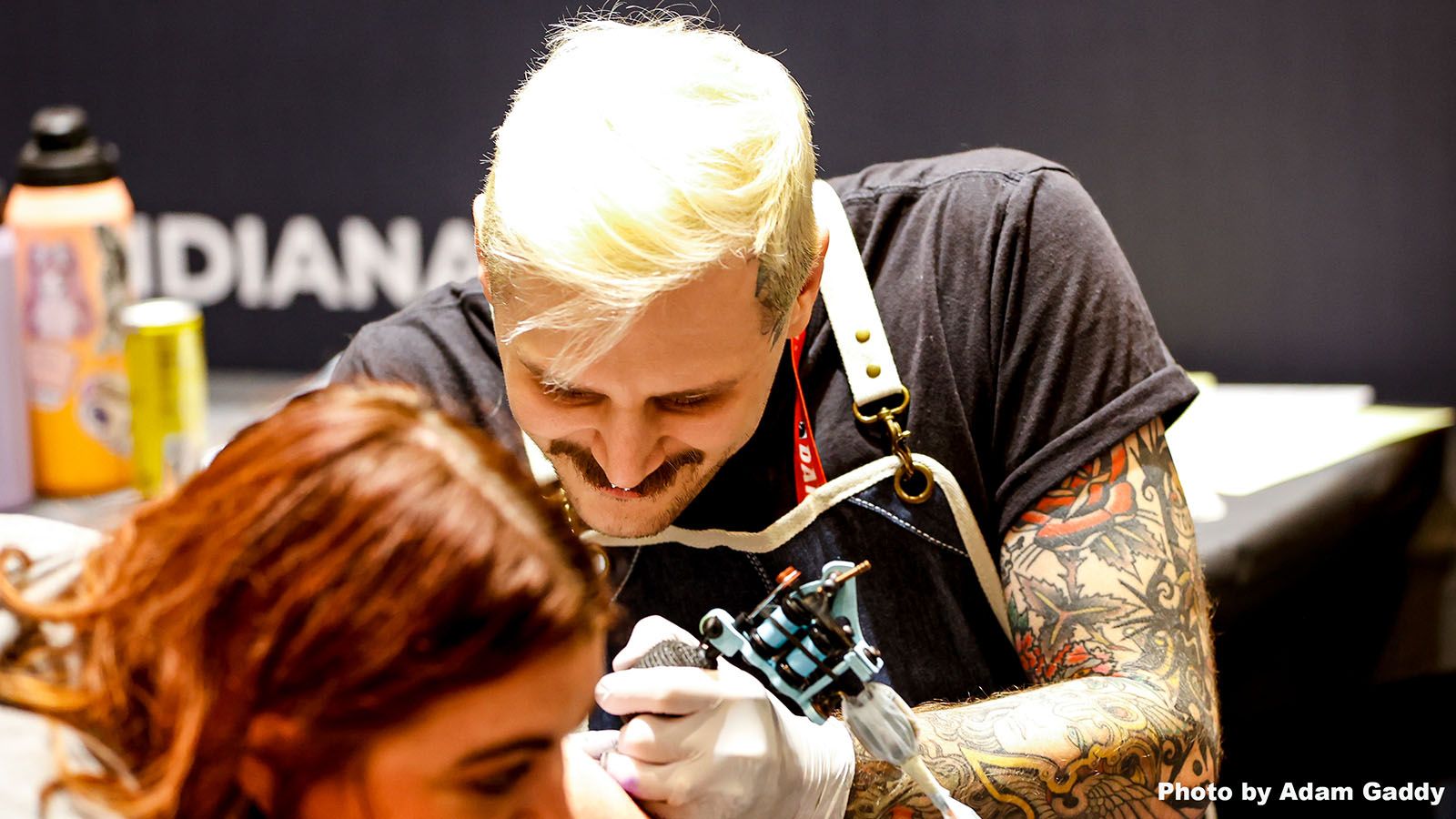 Garrett Weber of Studio13 does a tattoo for a client during last year's Fort Wayne Tattoo Festival.