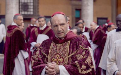 Ralph Fiennes portrays Cardinal-Dean Thomas Lawrence who is tasked with finding a new pope in Conclave.