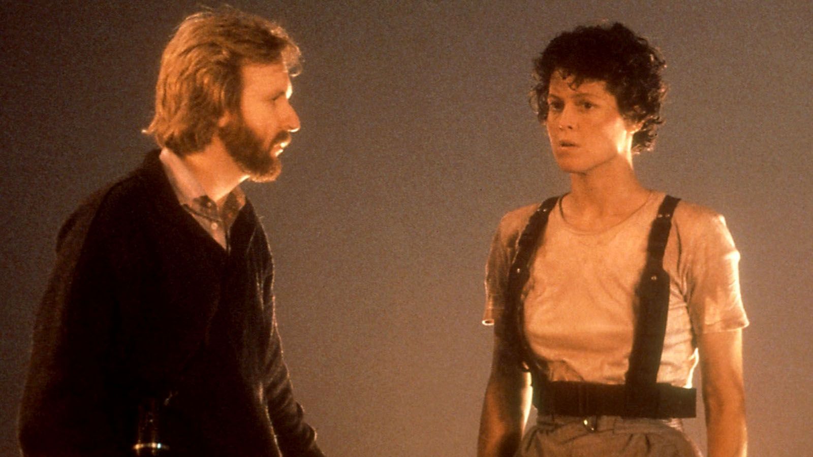 James Cameron works with Sigourney Weaver on the set of "Aliens."