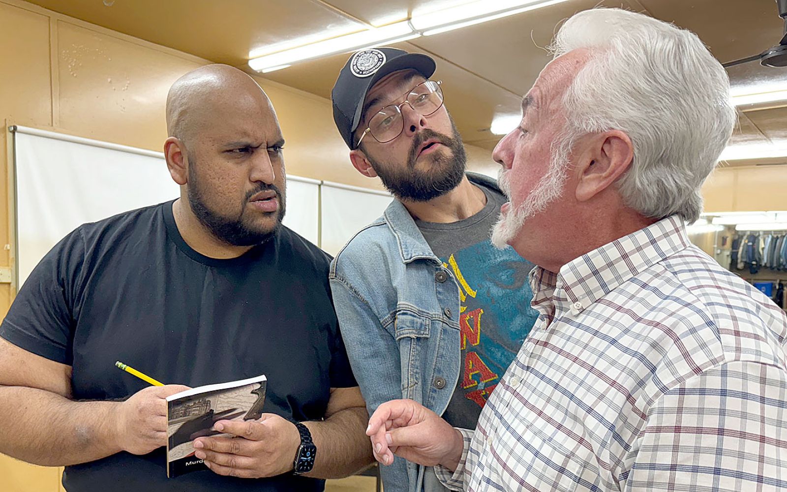 From left, Dimitri Wijesinghe, Joseph Adams, and Scott Rumage rehearse a scene for the upcoming production of Murdered to Death at Arena Dinner Theatre. The show, a spoof on the popular Agatha Christie whodunit genre, opens Friday, Oct. 25.