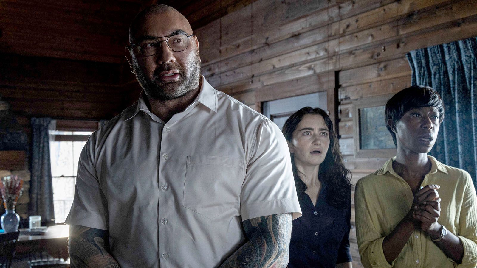 Knock at the Cabin stars, from left, Dave Bautista, Abby Quinn, and Nikki Amuka-Bird.